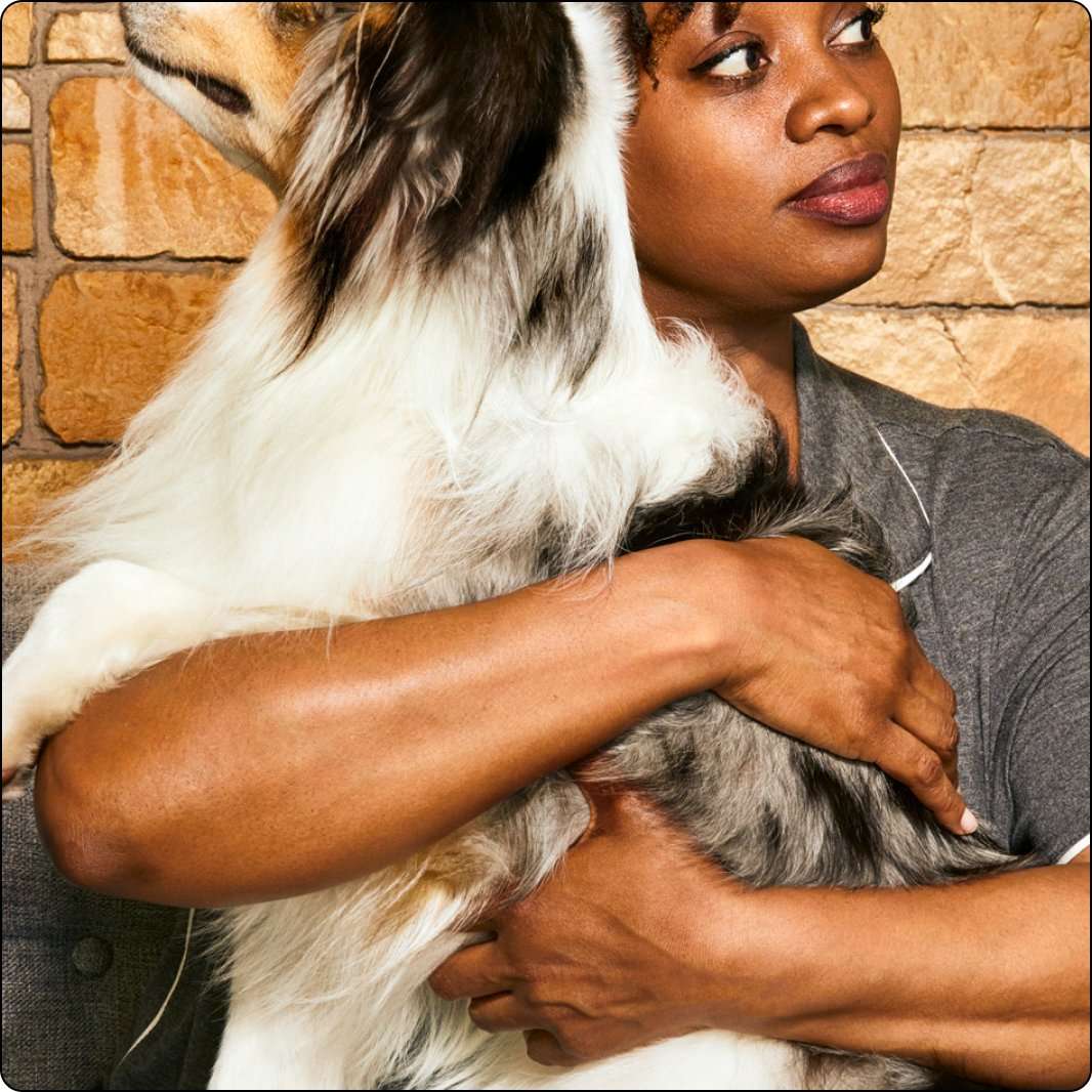 Woman holding her dog